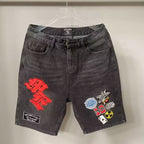 Mixed Emotion Multi‑Patch Black Denim Jorts